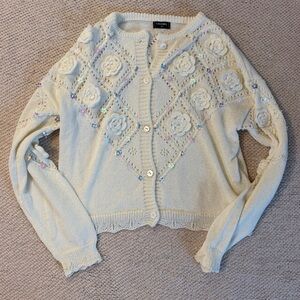 CHANEL Cream Cardigan with Floral Embellishments
